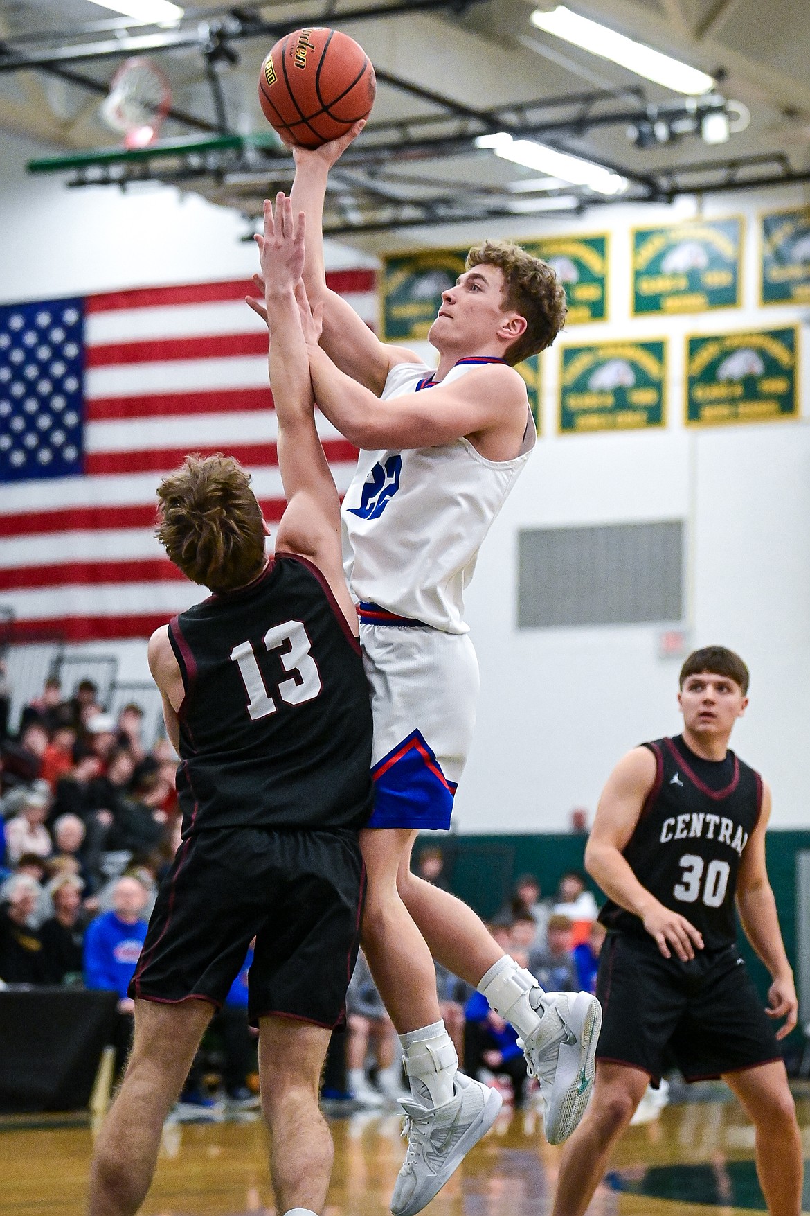 Columbia Falls' Reggie Sapa (22) shoots in the first half against Butte Central at the Western A Divisional Tournament at Whitefish High School on Thursday, March 6. (Casey Kreider/Daily Inter Lake)