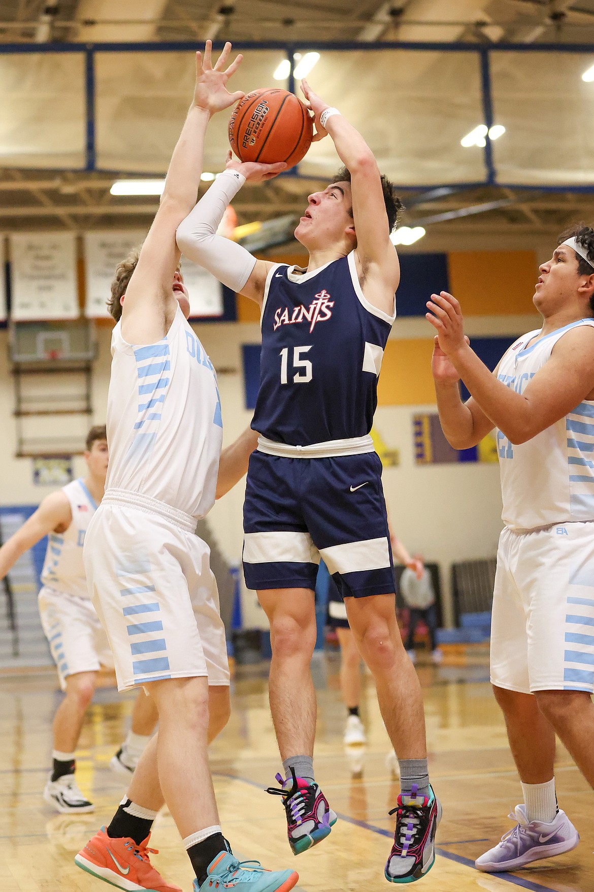 JASON DUCHOW PHOTOGRAPHY
Coeur du Christ junior Greg Hayes (15) shoots in traffic vs. Dietrich in the first round of the state 1A boys basketball tournament Thursday at Caldwell High.