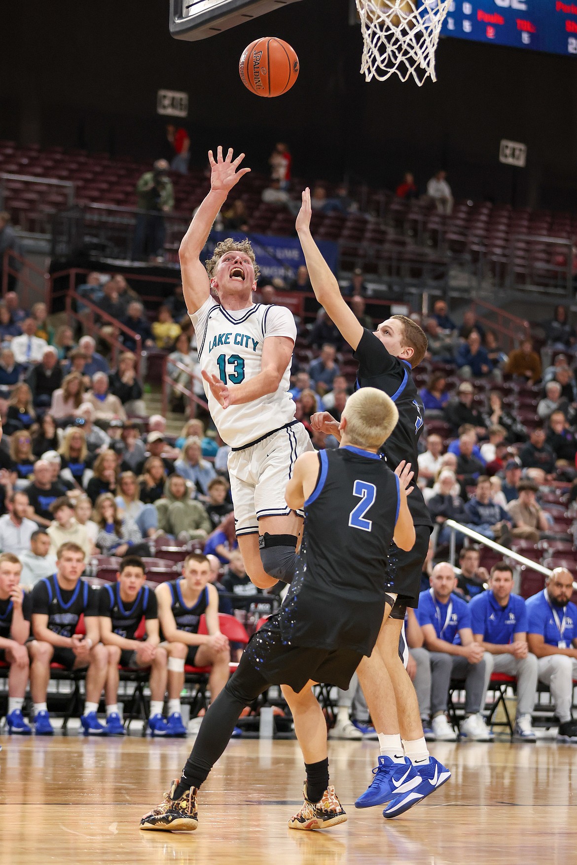 JASON DUCHOW PHOTOGRAPHY
Lake City junior Jackson Bowman (13) puts up a shot against Thunder Ridge on Thursday in the first round of the state 6A boys basketball tournament at the Ford Idaho Center in Nampa.