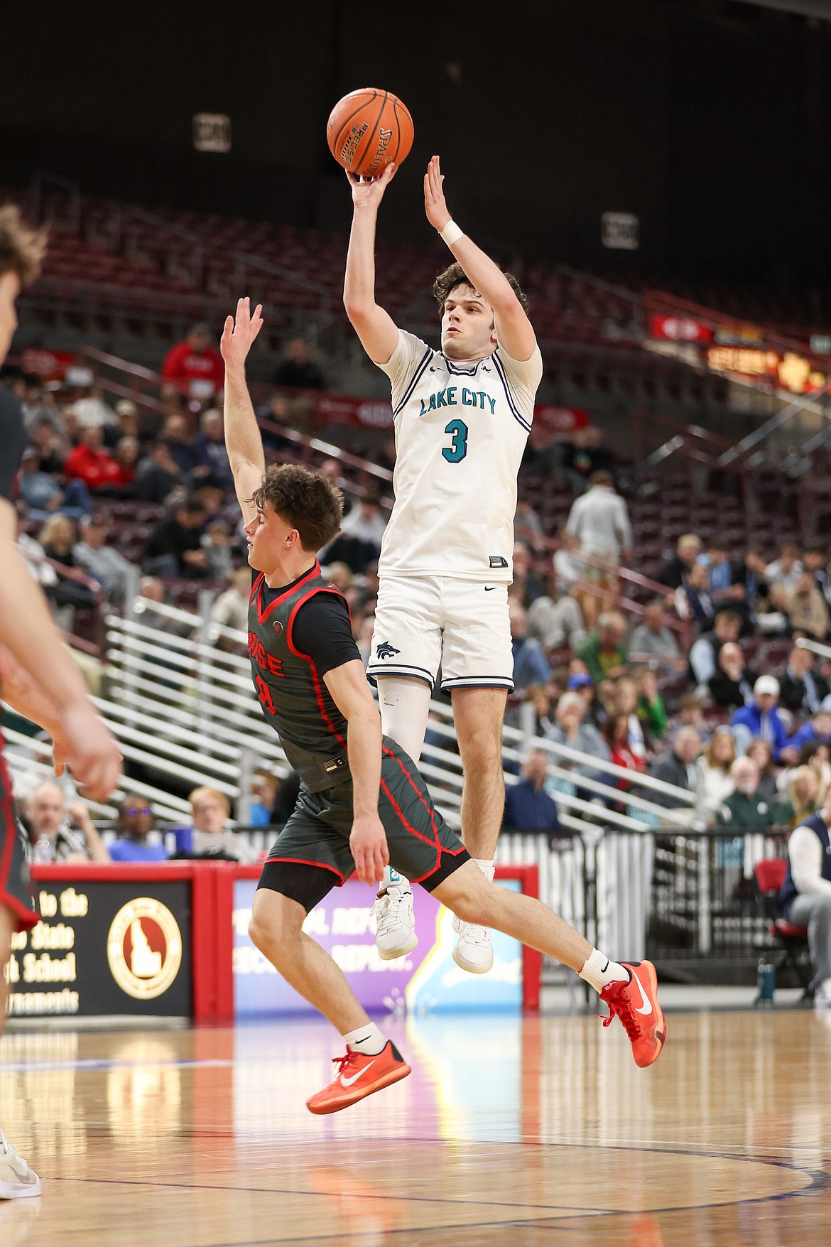 JASON DUCHOW PHOTOGRAPHY
Lake City senior guard Reese Strawn shoots over Boise defender Eli Rich during the first half of Friday's state 6A boys basketball semifinal game at the Ford Idaho Center in Nampa.