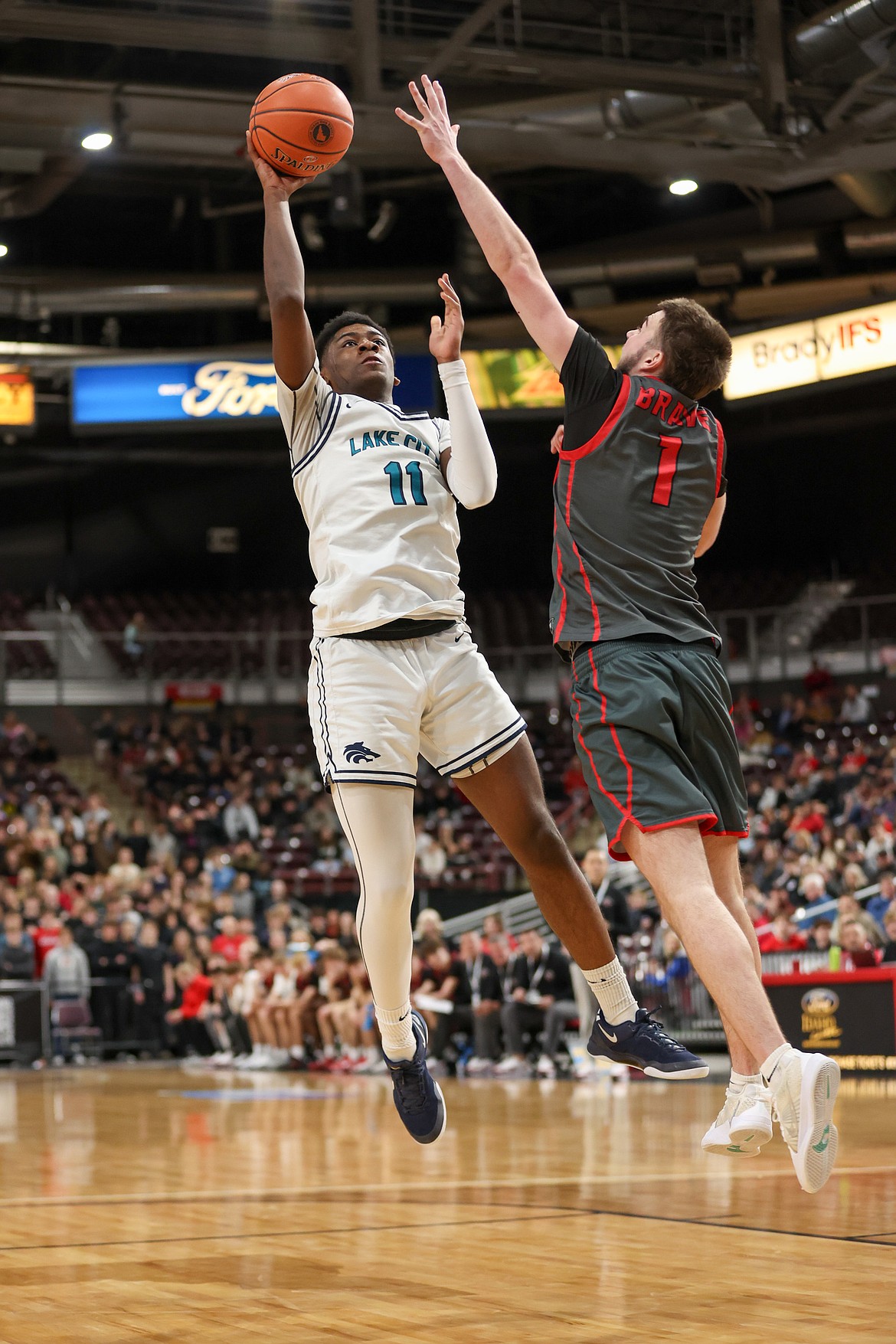 JASON DUCHOW PHOTOGRAPHY
Lake City junior Joshua Watson shoots over Boise's Will Gebert during the second half of Friday's game at the Ford Idaho Center in Nampa.