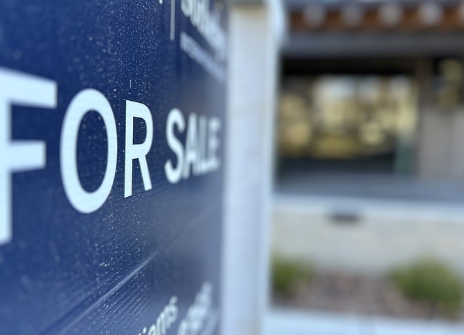 A "For Sale" sign marks a home on the market in Coeur d'Alene on Thursday, March 8.