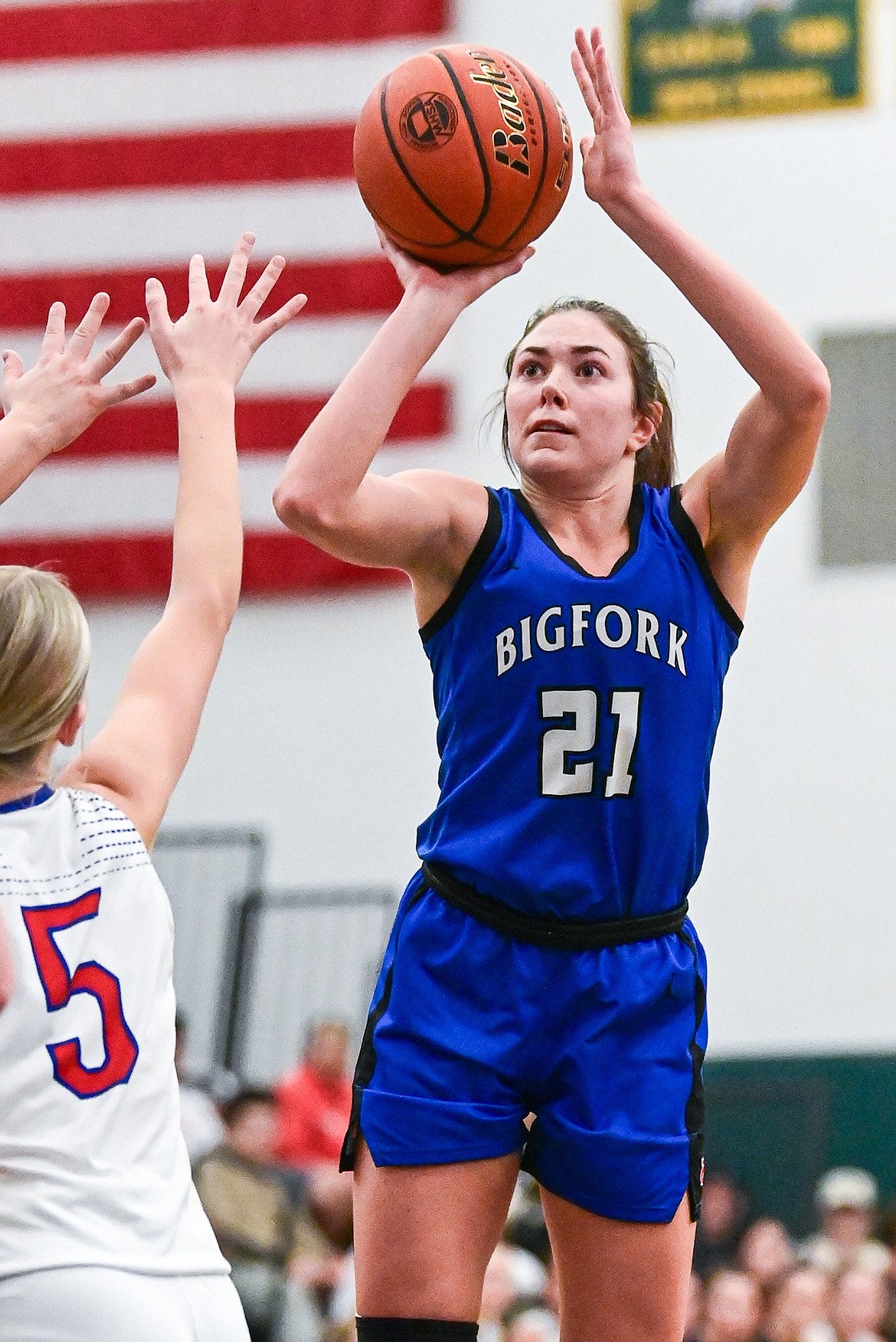 Bigfork's Braeden Gunlock (21) shoots against Columbia Falls in the consolation game of the Western A Divisional Basketball Tournament at Whitefish High School on Saturday, March 8. (Casey Kreider/Daily Inter Lake)