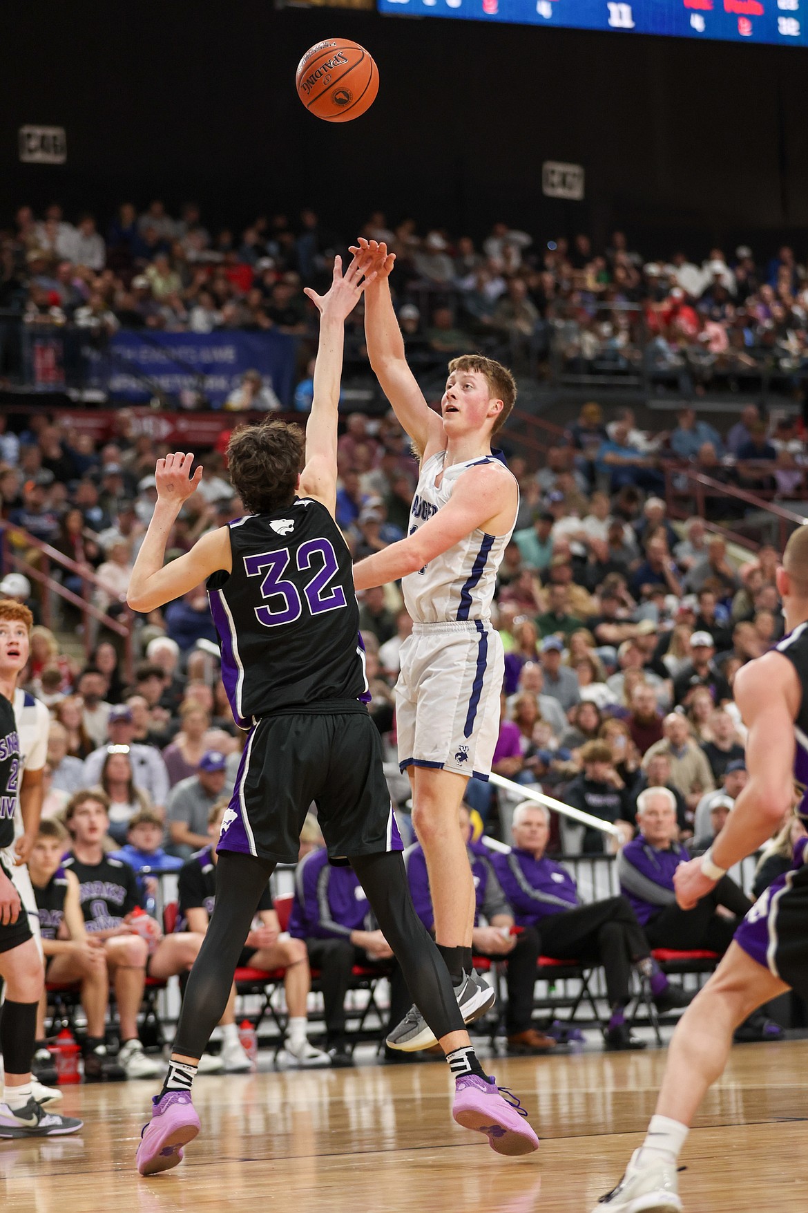 Bonners Ferry High senior Thomas Bateman puts up one of his signature jump-hook shots while guarded by 6-foot 9-inch Snake River High sophomore Bridjer Howard.