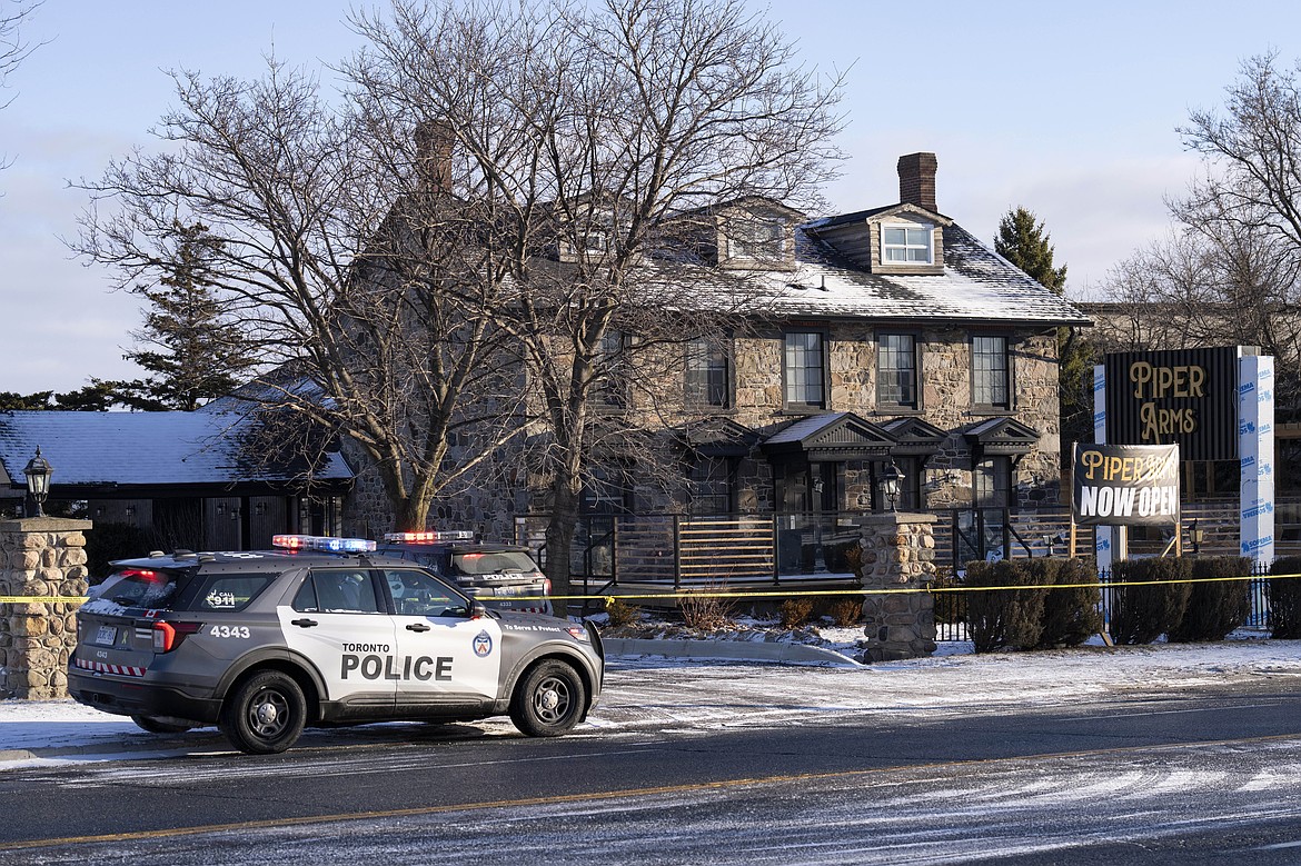 Police attend the scene of a shooting at a pub in Toronto, Canada, Saturday, March 8, 2025. (Arlyn McAdorey/The Canadian Press via AP)