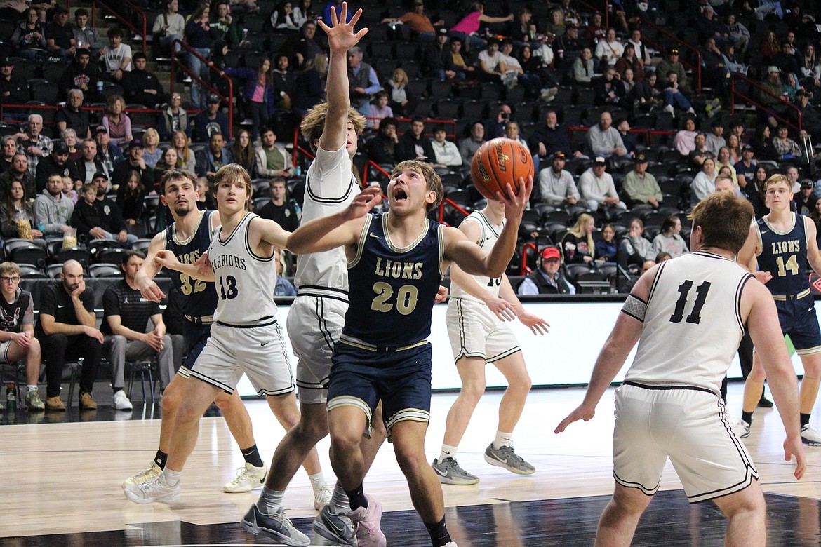 MLCA/CCS’s Max Gulenko (20) puts up the shot against ACH.