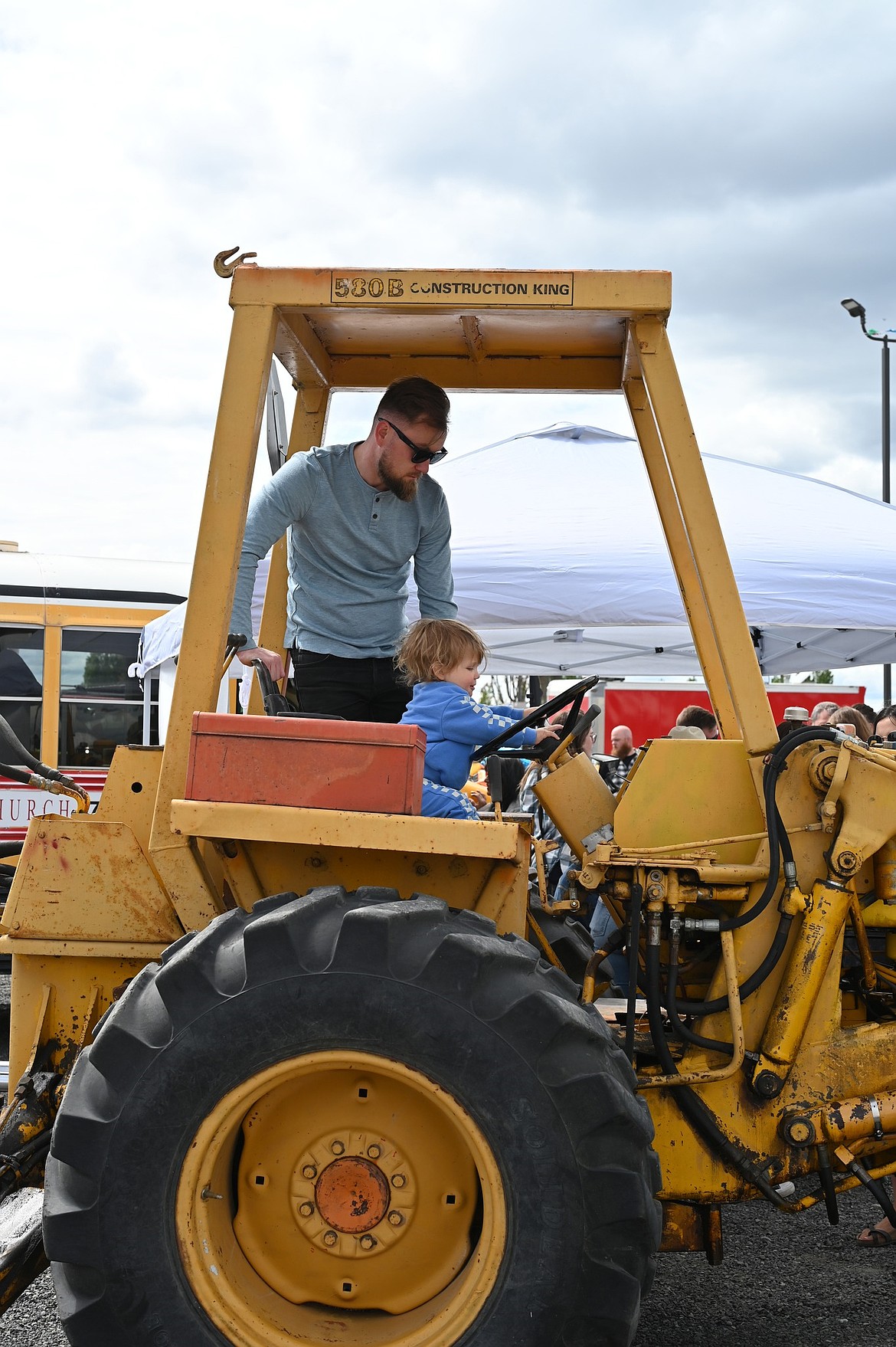 A small child gets to play a big equipment driver at last year’s Touch a Truck in Moses Lake. While all the details haven’t been settled, this year’s mechanical playground will include construction equipment, first responder vehicles and farm machines.