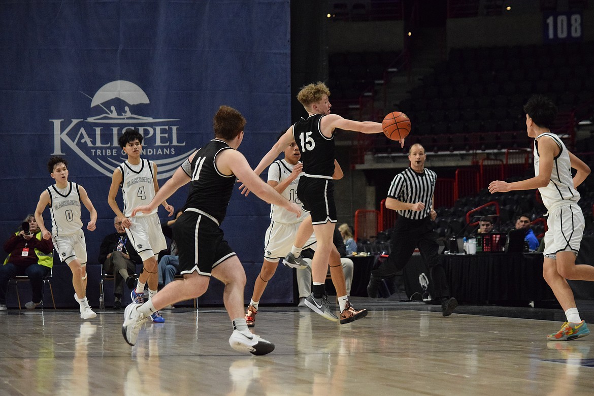 Warrior sophomore Max Grindy from Almira-Coulee/Hartline goes for a layup during the Class 1B state final Saturday. Grindy scored 16 points.