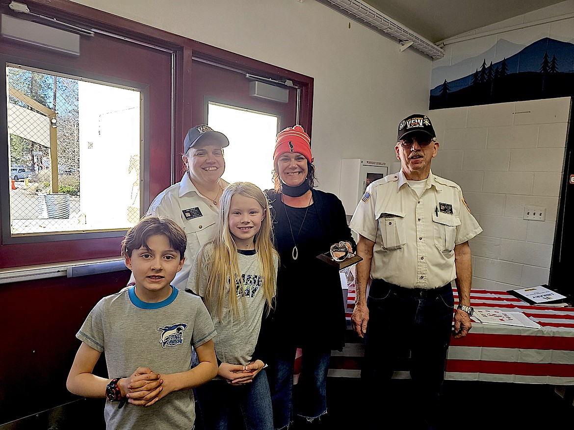 The Troy VFW members present their award to Ms. Mel Roesler-Begalke. From left, are Niccolo Davis, Amy Snow, Aubrey Wilson, Roesler-Begalke and Jerry Erickson. (Courtesy photo)