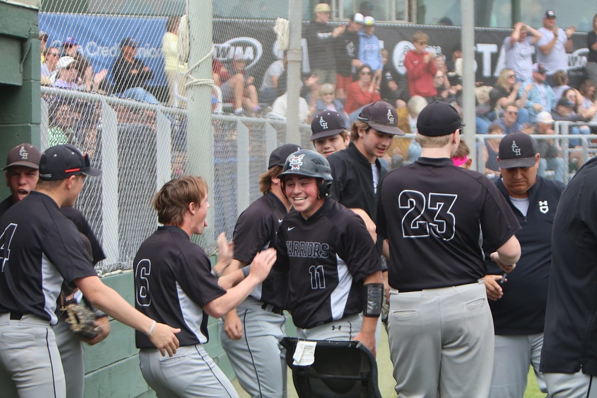 Carter Pitts celebrates with the Almira/Coulee-Hartline baseball team. The team went 9-0 against district opponents last year and 23-3 all season.