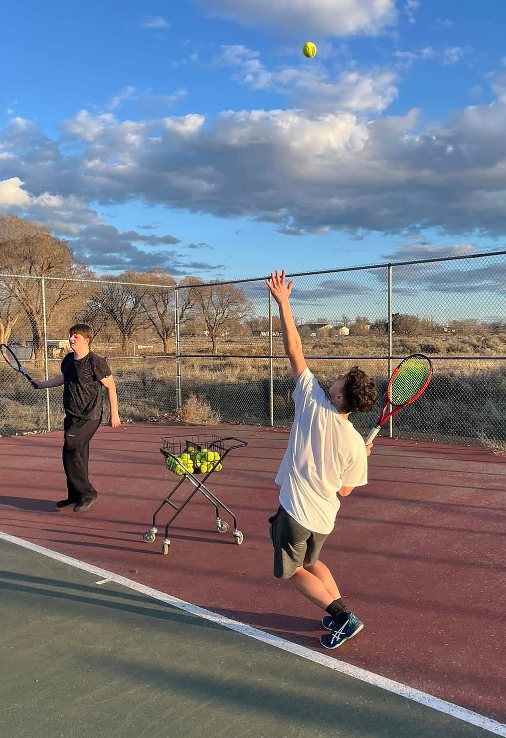The Soap Lake boys and girls tennis teams practice on the courts March 3 for their upcoming season. A handful of the players are returning but a good majority of the teams are new players.