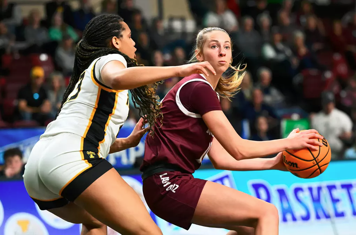RYAN BRENNECKE/University of Montana
Avery Waddington, right, of Montana looks to pass vs. Idaho in a quarterfinal game of the Big Sky Conference women’s basketball tournament Monday in Boise.