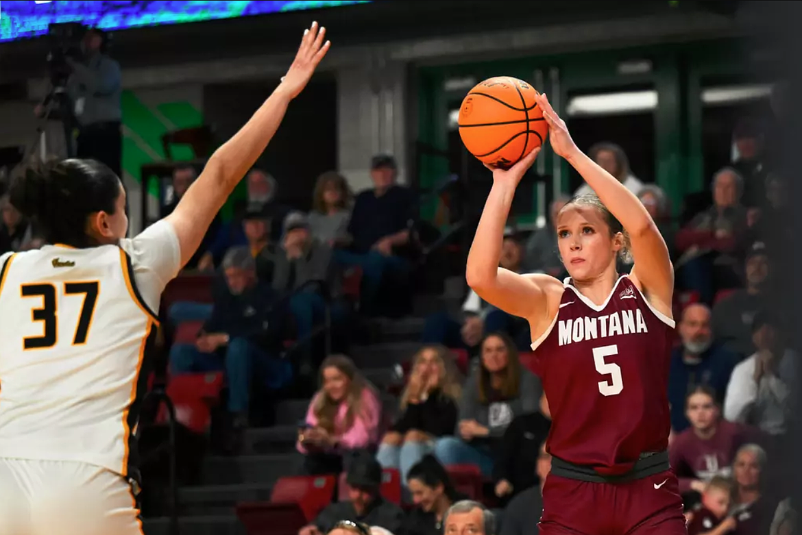 RYAN BRENNECKE/University of Montana
Tyler McCliment-Call (5) of Montana shoots over Ana Pinheiro of Idaho in a quarterfinal game of the Big Sky Conference women’s basketball tournament Monday in Boise.