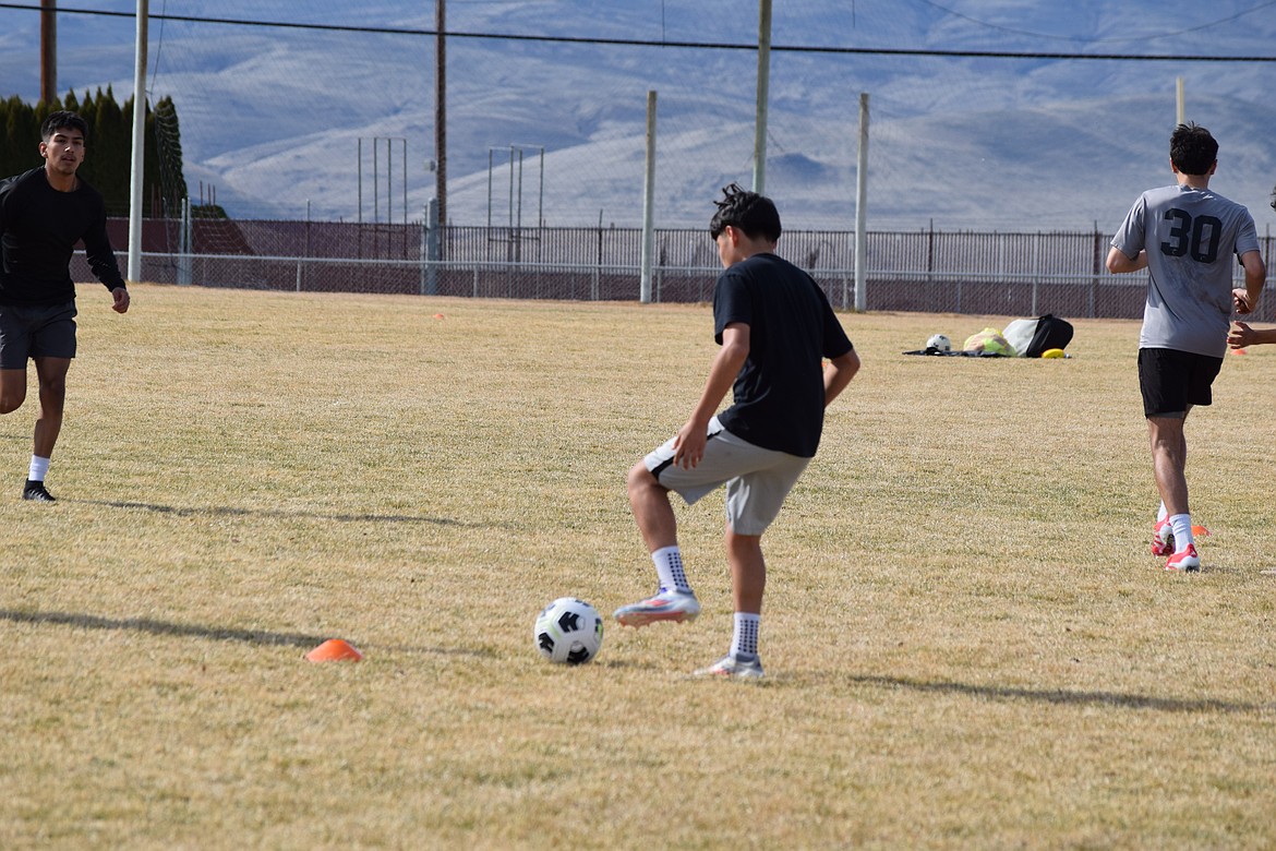 Wahluke players run drills designed to focus on ball control and working around other players on the field. Coach Cele Lopez said he wants the students to be able to reflexively respond to the plays their opponents put out this year.