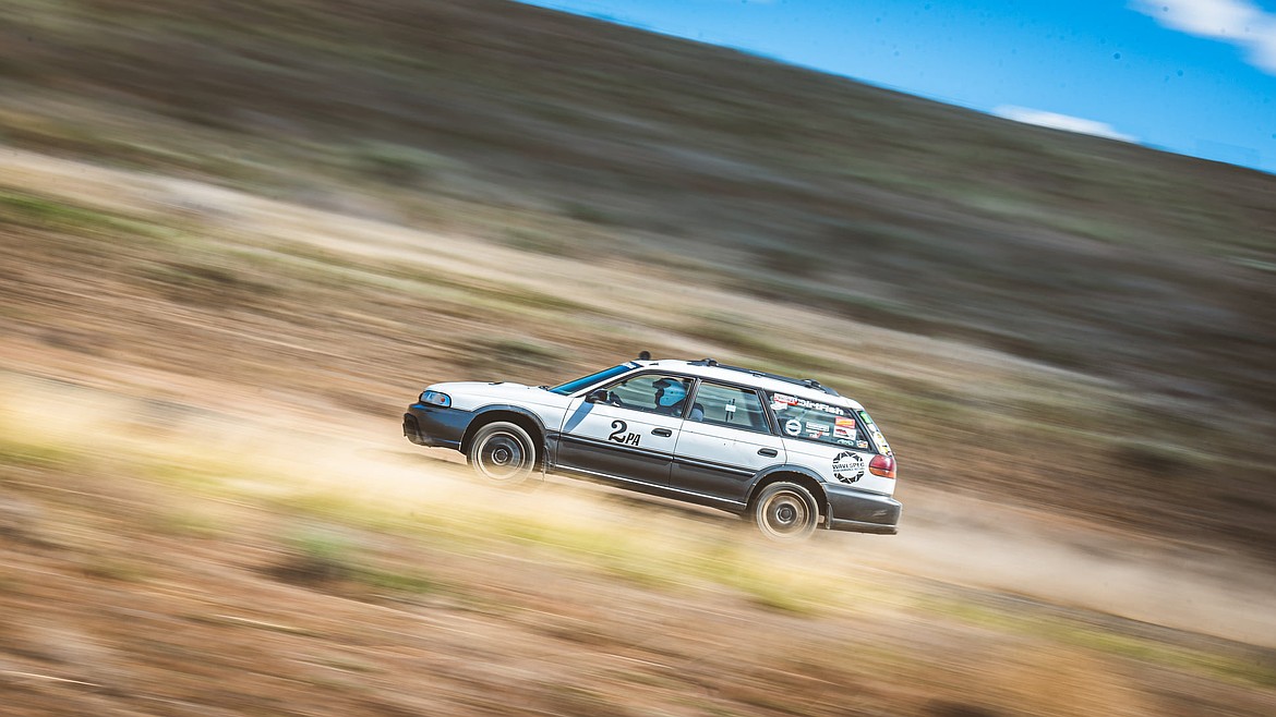 Eric Holcomb drives in a rallycross event in Lind. Drivers at the event, which takes place this weekend, are happy to let spectators ride along with them; all anyone has to do is find a staff member wearing a green vest and ask.