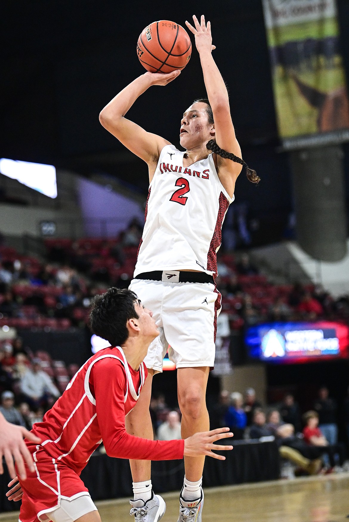 Browning's Jude Reevis (2) rises to shoot in the second half against Glendive at the Class A State Basketball Tournament at the MetraPark First Interstate Arena in Billings on Thursday, March 13. (Casey Kreider/Daily Inter Lake)