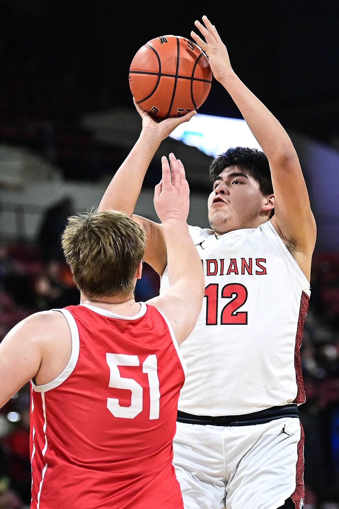 Browning's Royce Mad Plume (12) rises to shoot in the second half against Glendive at the Class A State Basketball Tournament at the MetraPark First Interstate Arena in Billings on Thursday, March 13. (Casey Kreider/Daily Inter Lake)
