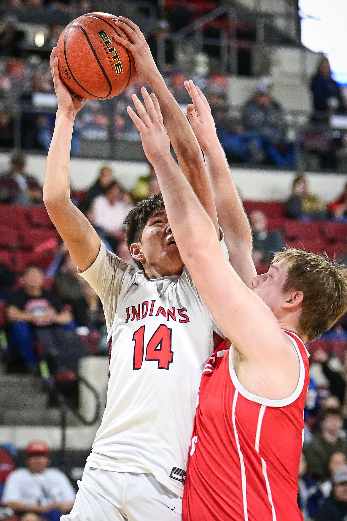 Browning's Joshua Skunkcap (14) rises to shoot in the first half against Glendive at the Class A State Basketball Tournament at the MetraPark First Interstate Arena in Billings on Thursday, March 13. (Casey Kreider/Daily Inter Lake)