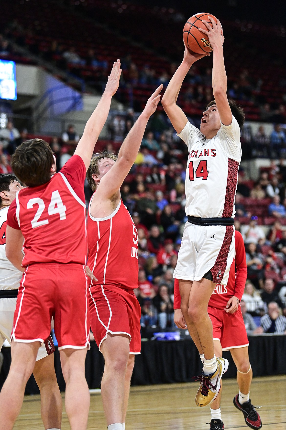 Browning's Joshua Skunkcap (14) rises to shoot in the first half against Glendive at the Class A State Basketball Tournament at the MetraPark First Interstate Arena in Billings on Thursday, March 13. (Casey Kreider/Daily Inter Lake)