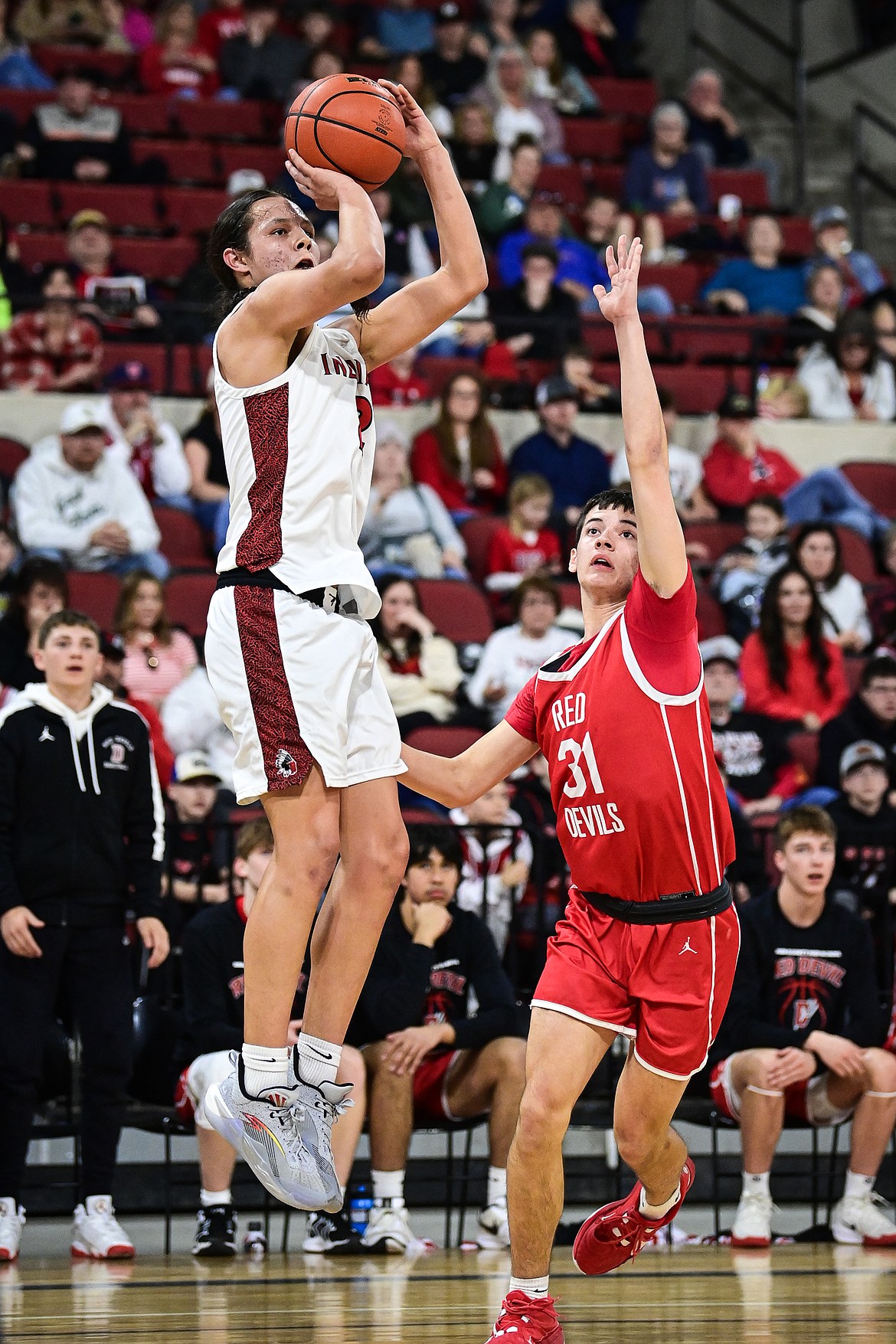 Browning's Jude Reevis (2) rises to shoot in the first half against Glendive at the Class A State Basketball Tournament at the MetraPark First Interstate Arena in Billings on Thursday, March 13. (Casey Kreider/Daily Inter Lake)