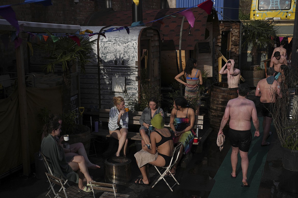 Visitors enjoy their sauna session at the Hackney Wick Community Sauna Baths, in London, Tuesday, Feb. 25, 2025. (AP Photo/Kin Cheung)