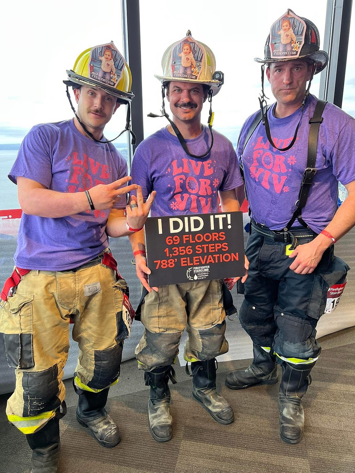 Dan Parrish of Northern Lakes Fire Protection District, Fire Chief John Miller of Shoshone Fire No. 1 Firefighters and volunteer firefighter Jeff Littlefield wear their "Live for Viv" gear at the Leukemia and Lymphoma Society Firefighter Stair Climb Sunday.