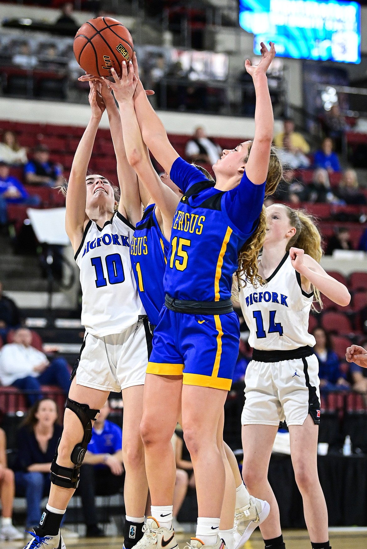 Bigfork's Chloe Norred (10) battles for a rebound in the first half against Lewistown at the Class A State Basketball Tournament at the MetraPark First Interstate Arena in Billings on Friday, March 14. (Casey Kreider/Daily Inter Lake)