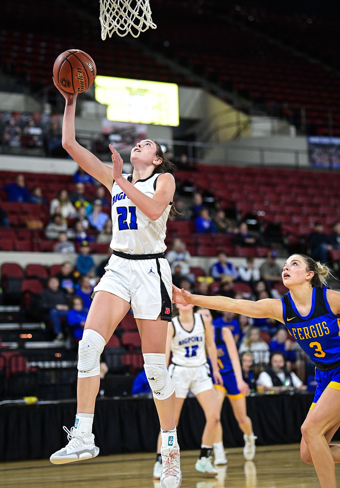 Bigfork's Braeden Gunlock (21) drives to the basket in the second half against Lewistown at the Class A State Basketball Tournament at the MetraPark First Interstate Arena in Billings on Friday, March 14. (Casey Kreider/Daily Inter Lake)