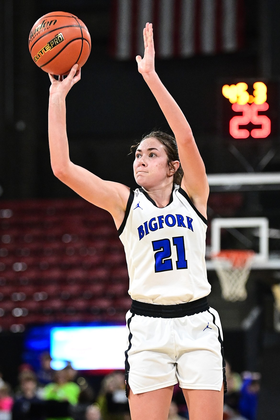 Bigfork's Braeden Gunlock (21) sinks a three in the final minute of the fourth quarter against Lewistown at the Class A State Basketball Tournament at the MetraPark First Interstate Arena in Billings on Friday, March 14. (Casey Kreider/Daily Inter Lake)