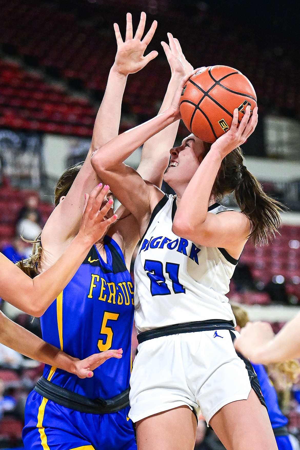 Bigfork's Braeden Gunlock (21) drives to the basket in the first half against Lewistown at the Class A State Basketball Tournament at the MetraPark First Interstate Arena in Billings on Friday, March 14. (Casey Kreider/Daily Inter Lake)