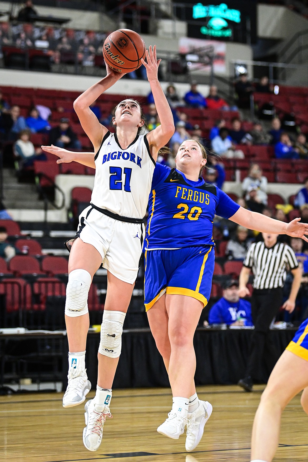 Bigfork's Braeden Gunlock (21) drives to the basket in the second half against Lewistown at the Class A State Basketball Tournament at the MetraPark First Interstate Arena in Billings on Friday, March 14. (Casey Kreider/Daily Inter Lake)