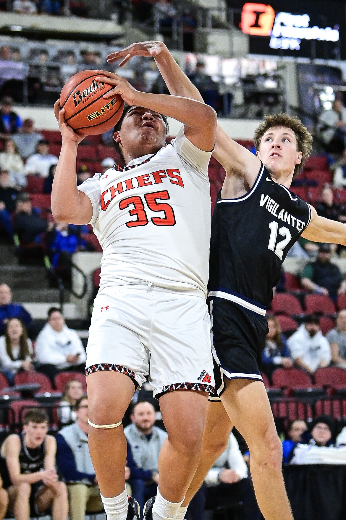 Ronan's Teddy Spotted Eagle (35) draws a foul on a shot in the second half against East Helena at the Class A State Basketball Tournament at the MetraPark First Interstate Arena in Billings on Friday, March 14. (Casey Kreider/Daily Inter Lake)