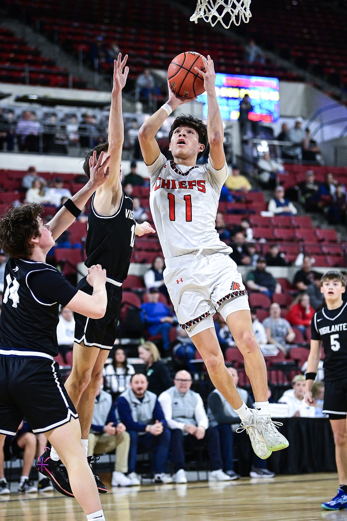 Ronan's Wade Qualtier (11) drives to the basket in the first half against East Helena at the Class A State Basketball Tournament at the MetraPark First Interstate Arena in Billings on Friday, March 14. (Casey Kreider/Daily Inter Lake)