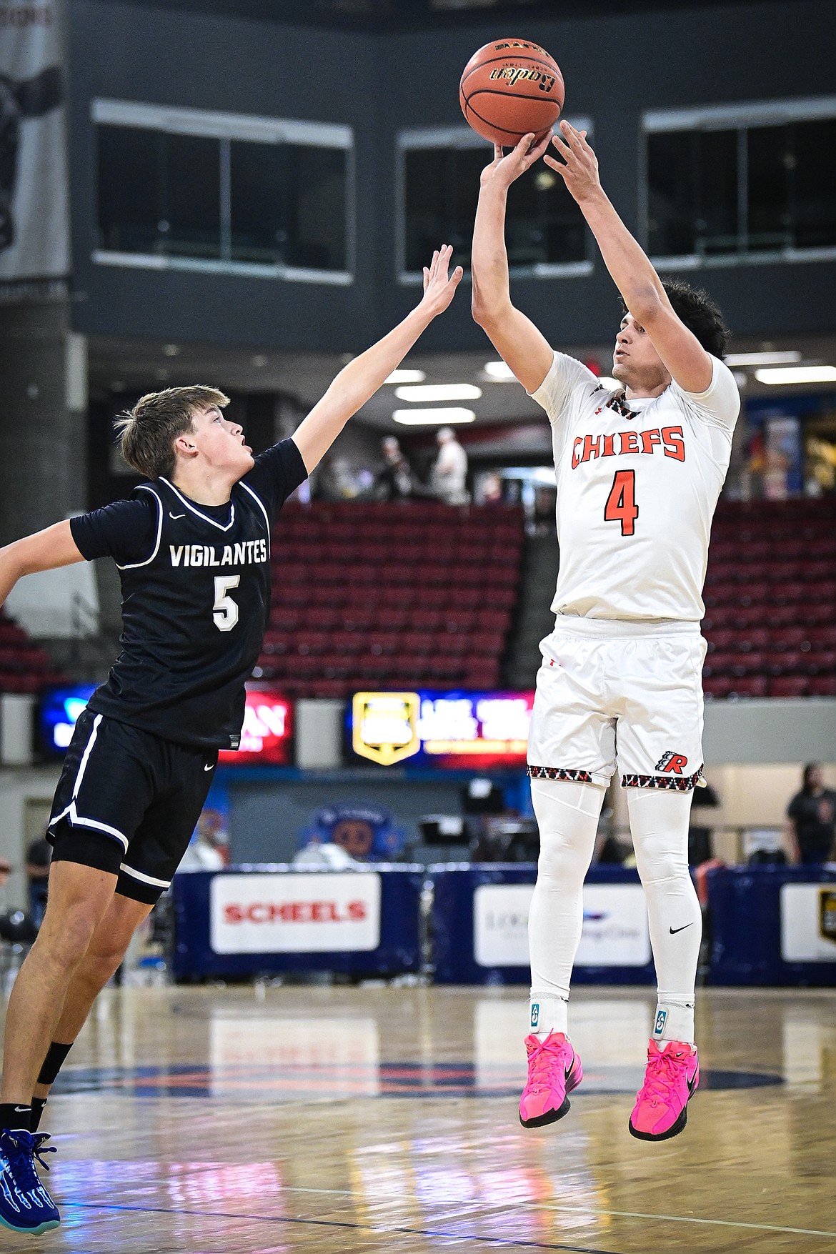 Ronan's Kolby Finley (4) shoots in the first half guarded by East Helena's Avery Hager (5) at the Class A State Basketball Tournament at the MetraPark First Interstate Arena in Billings on Friday, March 14. (Casey Kreider/Daily Inter Lake)