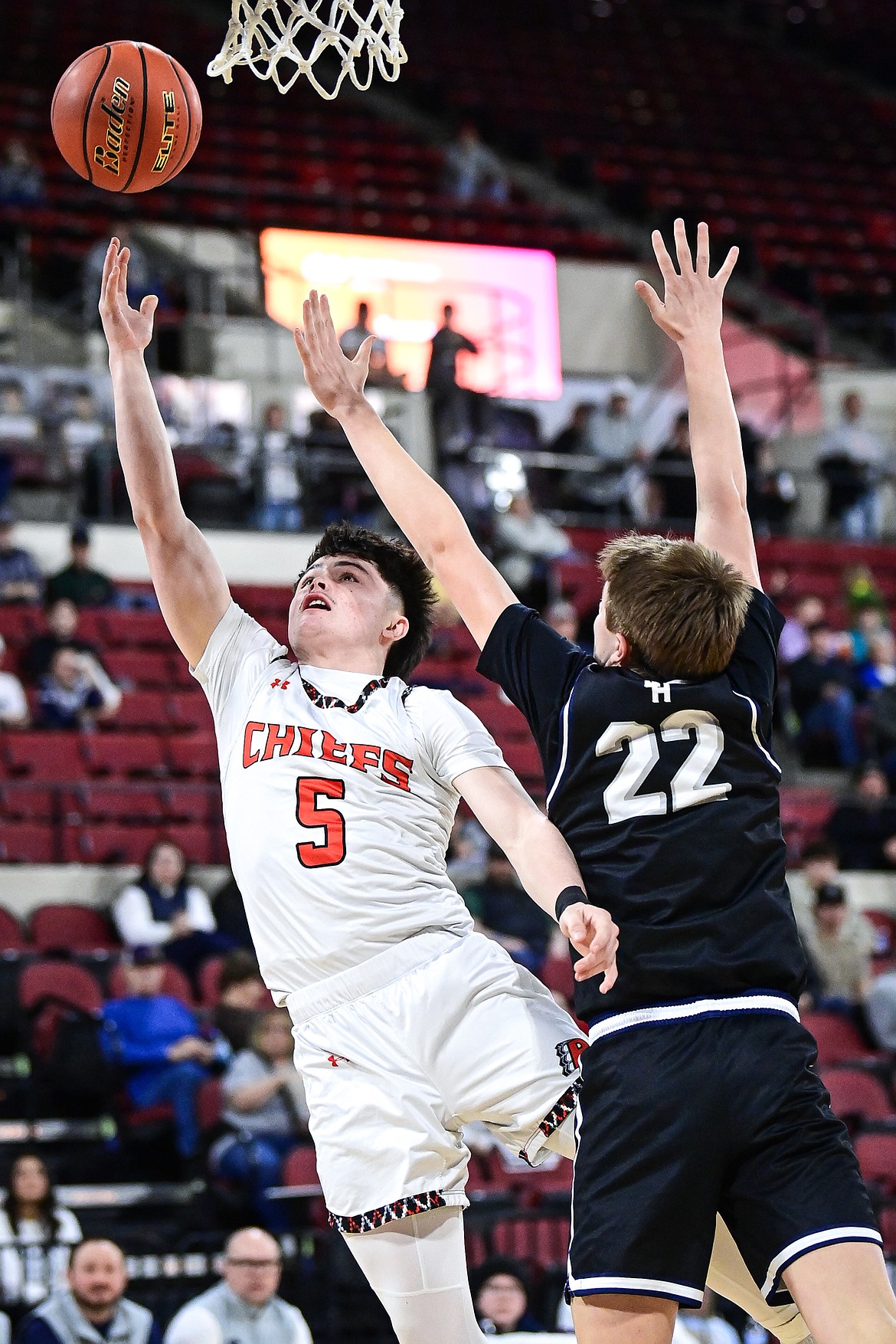 Ronan's Laurance Lozeau (5) drives to the basket in the first half against East Helena at the Class A State Basketball Tournament at the MetraPark First Interstate Arena in Billings on Friday, March 14. (Casey Kreider/Daily Inter Lake)