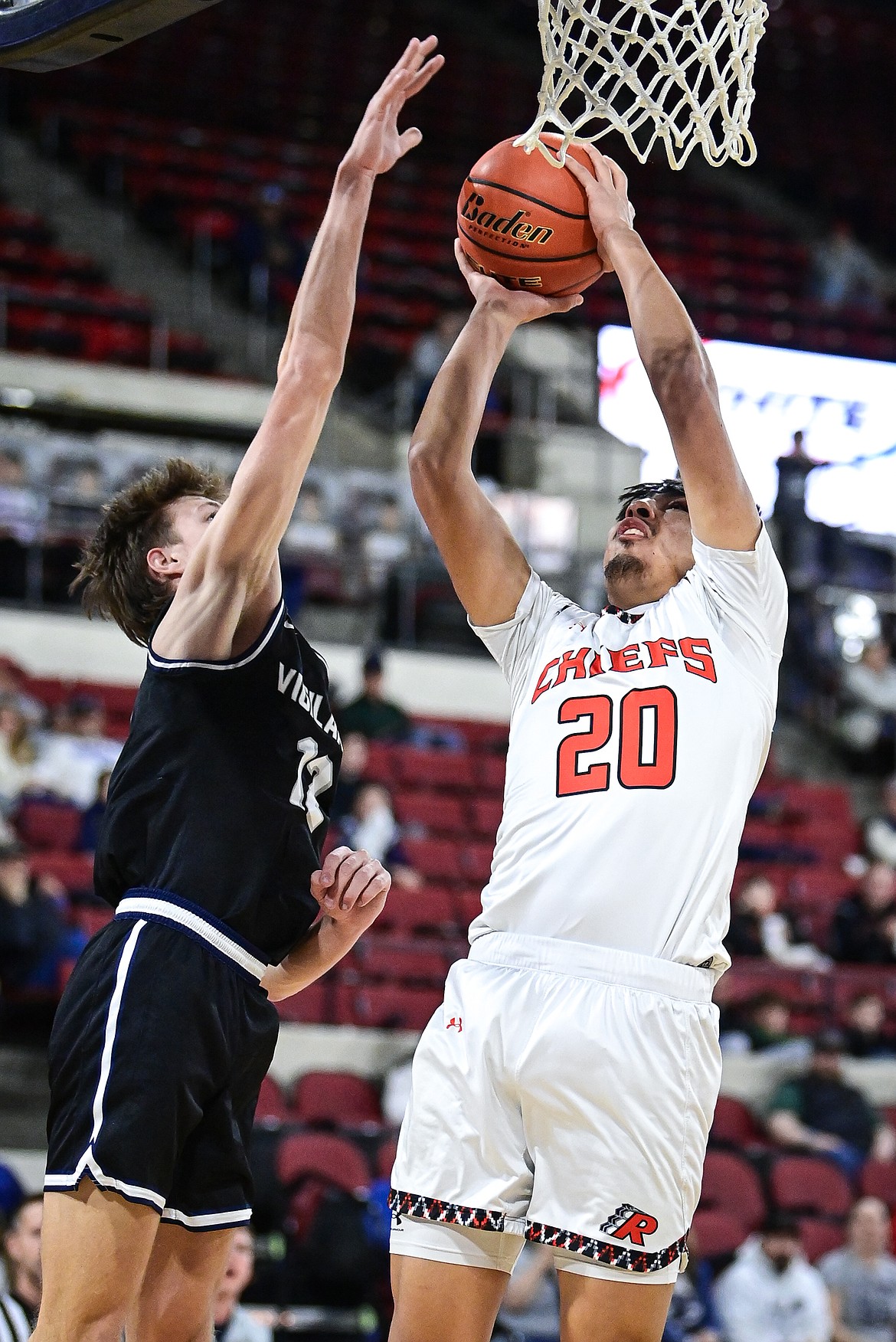 Ronan's Chad Higgins (20) shoots in the first half against East Helena at the Class A State Basketball Tournament at the MetraPark First Interstate Arena in Billings on Friday, March 14. (Casey Kreider/Daily Inter Lake)