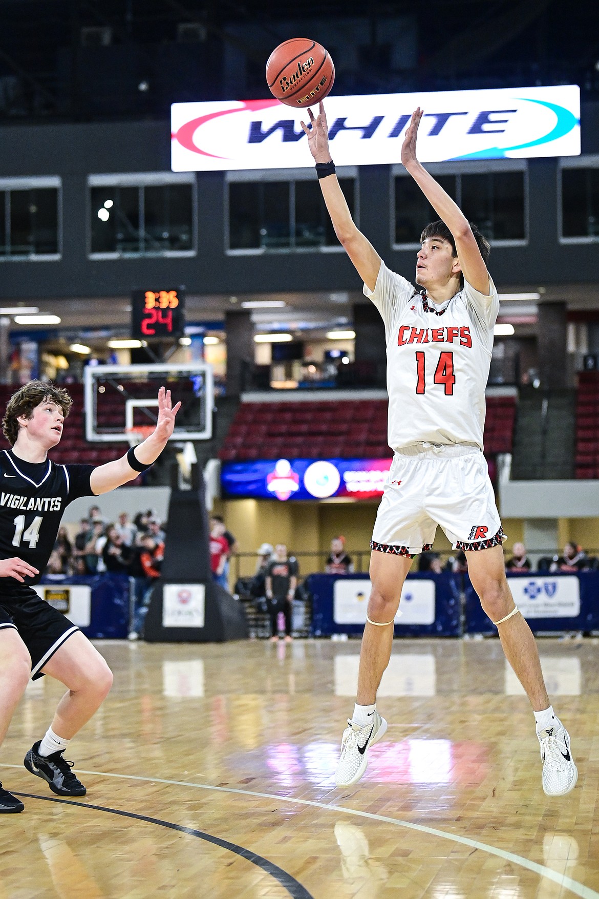 Ronan's Jhett McDonald (14) shoots in the first half against East Helena at the Class A State Basketball Tournament at the MetraPark First Interstate Arena in Billings on Friday, March 14. (Casey Kreider/Daily Inter Lake)