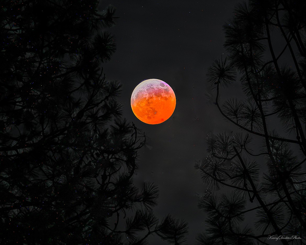 A blood moon glows over Kootenai County during a total lunar eclipse on Thursday night.