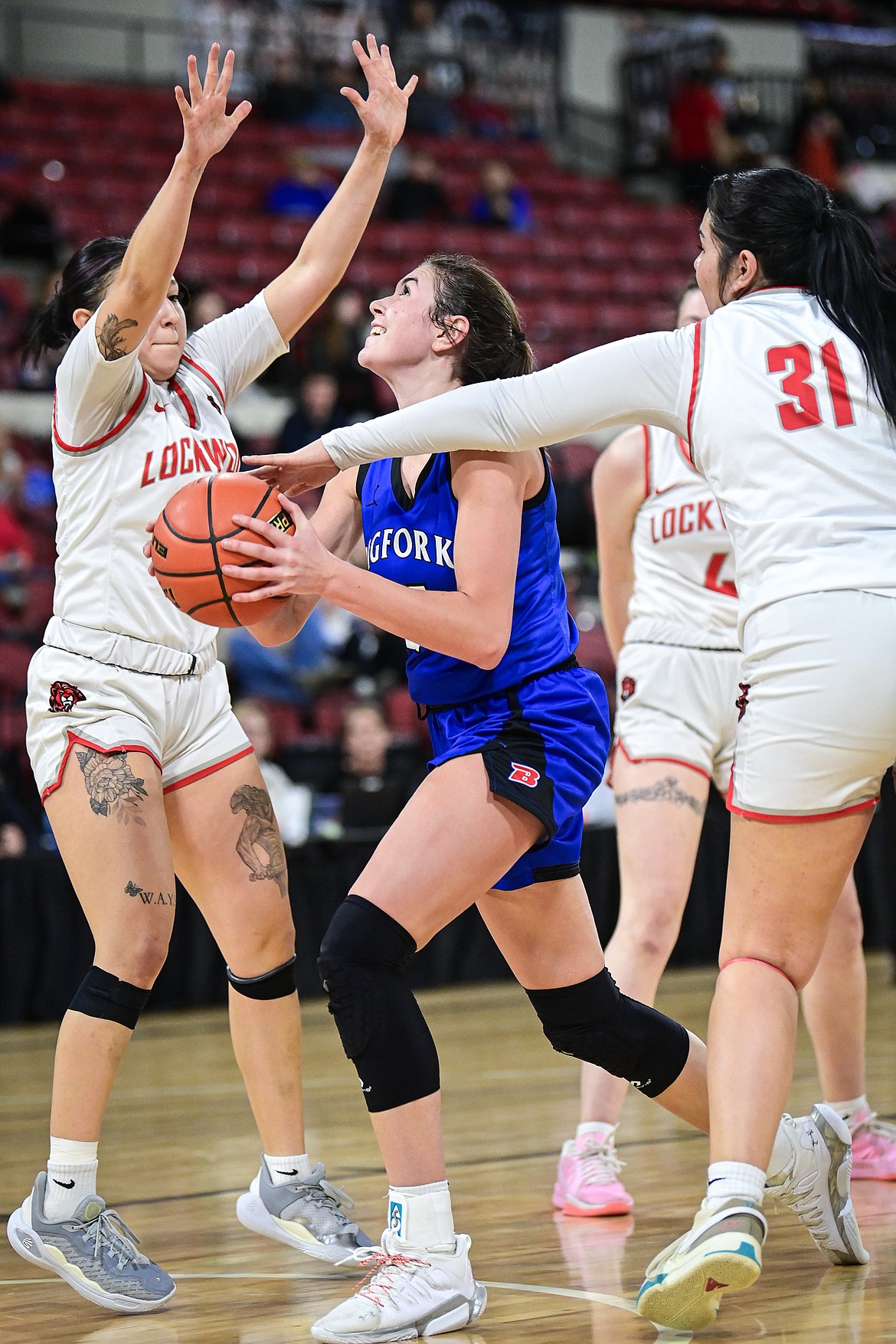 Bigfork's Braeden Gunlock (21) drives to the basket in the fourth quarter against Lockwood at the Class A State Basketball Tournament at the MetraPark First Interstate Arena in Billings on Saturday, March 15. (Casey Kreider/Daily Inter Lake)