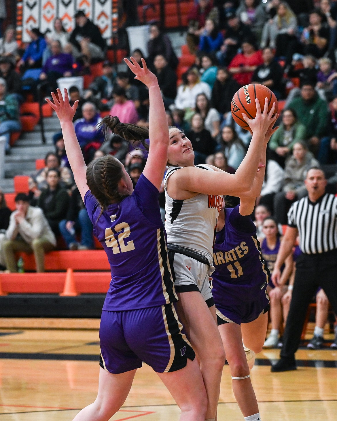 Ronan Maiden Maddy Illig goes up strong for a layup against Polson. (Christa Umphrey photo)