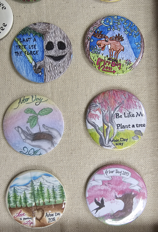 These buttons show examples of the results of the art contest the Arbor Day Organization of North Idaho held for 25 years.