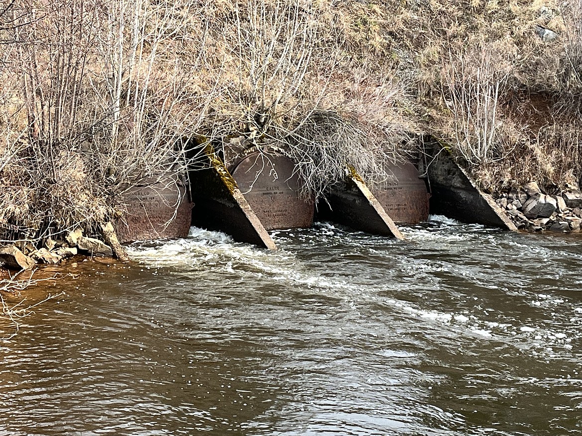 Rainfall and early spring runoff in Fourth of July Creek have caused a partial collapse of culverts and damaged the flood gates beneath River Road near Dudley.