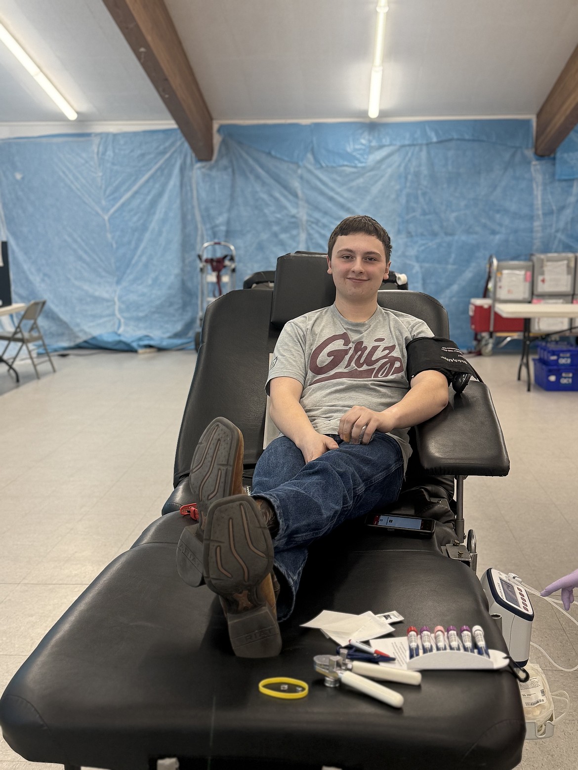 All smiles and happy, Oscar Wolff is comfortable as he donates blood last week. (Monte Turner/Mineral Independent)