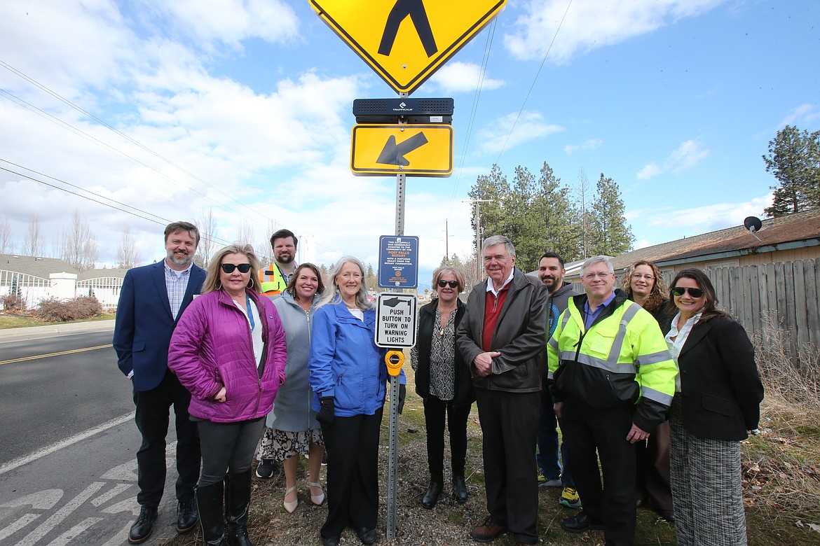 A newly installed crosswalk at Compton Street and Poleline Avenue has been dedicated to the founding members of the Post Falls Rotary Club, which was formed 30 years ago. From left: Bob Seale, Amy Boni, Chris Schneider, Christina Petit, Kay Viebrock, Pam Houser, Tom Malzahn, Chad Rittenour, Robert Palus, April Fortier and Christi Fleischman.