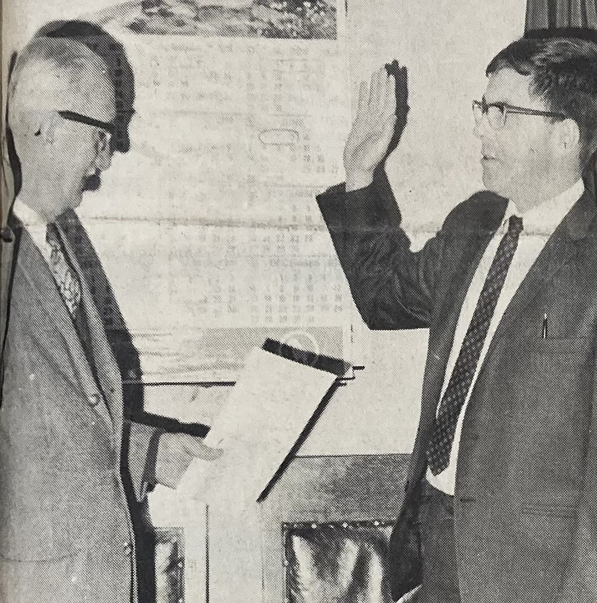 Commissioner Henry J. Meyer, left, swears in Post Falls attorney James Judd as Kootenai County’s first public defender in 1970.