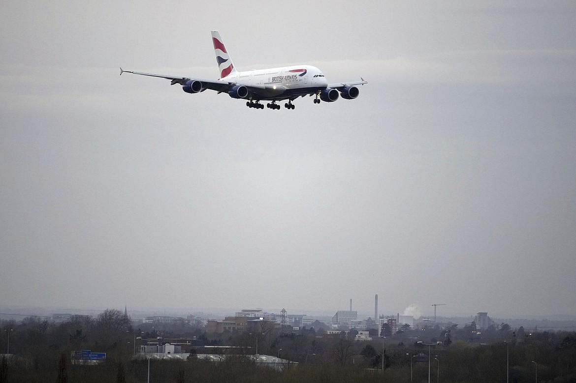 A British Airways plane approaches landing as authorities announced a partial resumption of flights after a fire at a nearby electrical substation has caused a closure of Europe's busiest airport in London, Friday, March 21, 2025.(AP Photo/Kin Cheung)