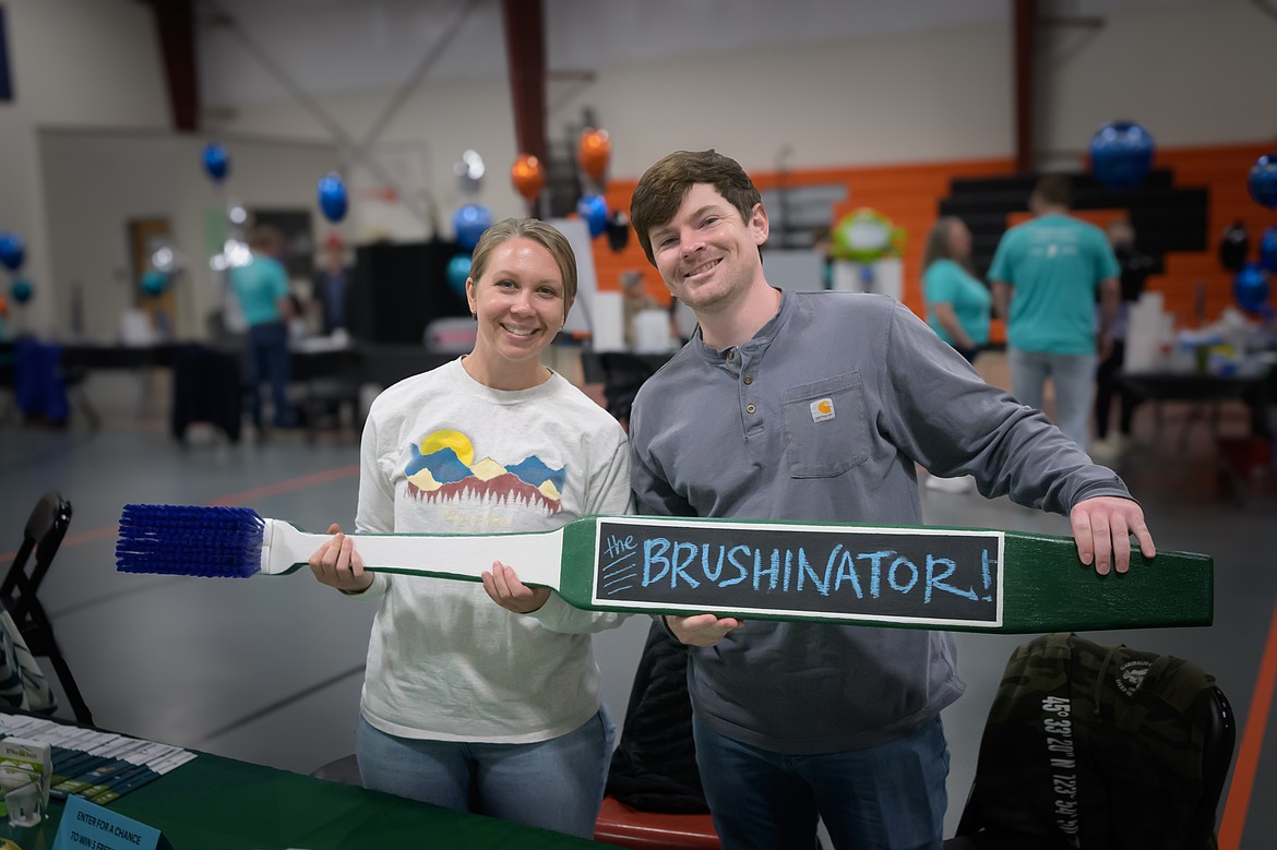 Local dentist Dr. Blake Sherwood and Dana Sherwood show off their extra-large toothbrush called The BRUSHINATOR. (Tracy Scott/Valley Press)