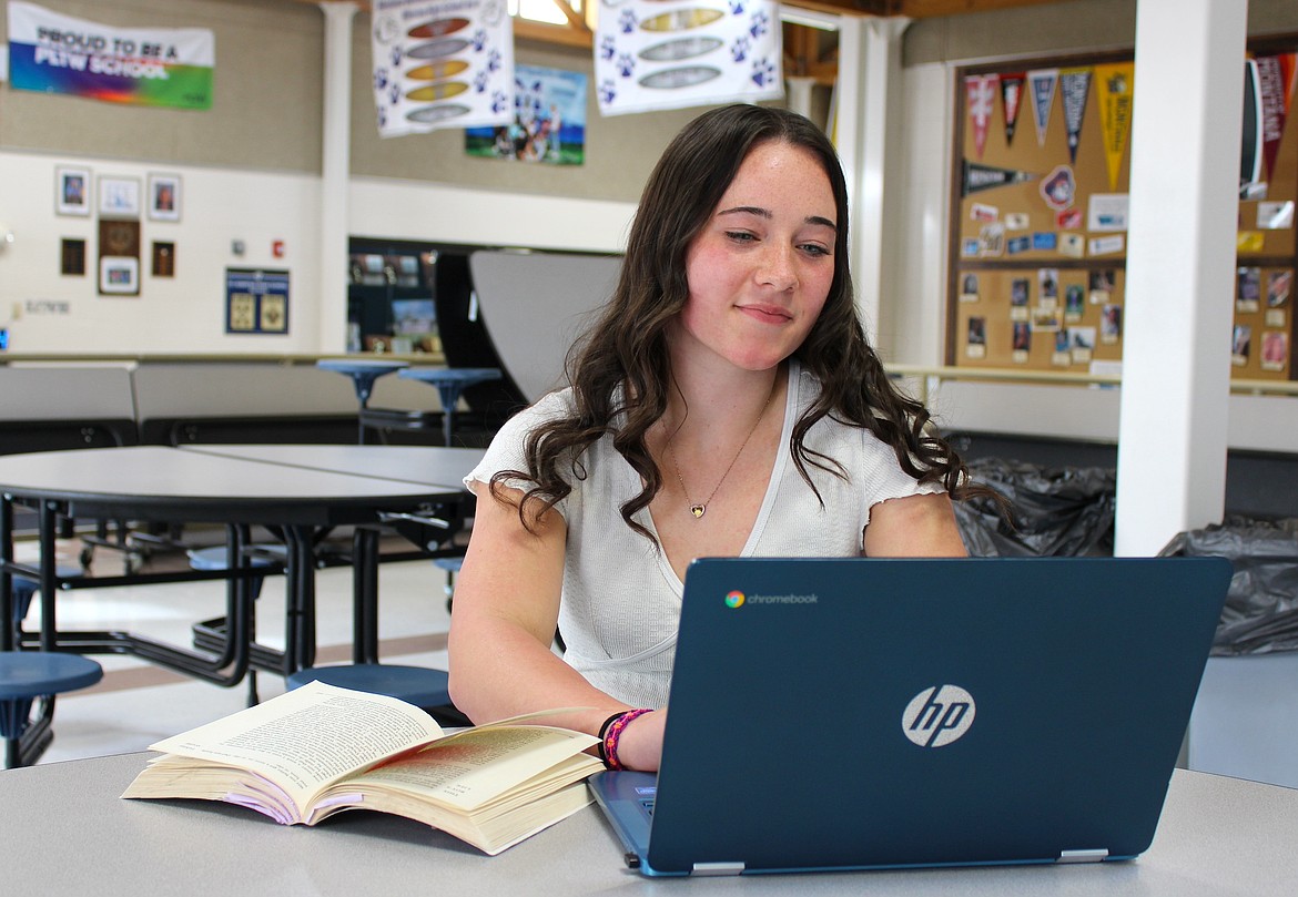 Amelia Cronk studies in the St. Ignatius High School commons. (Kaleb Unger/Leader)