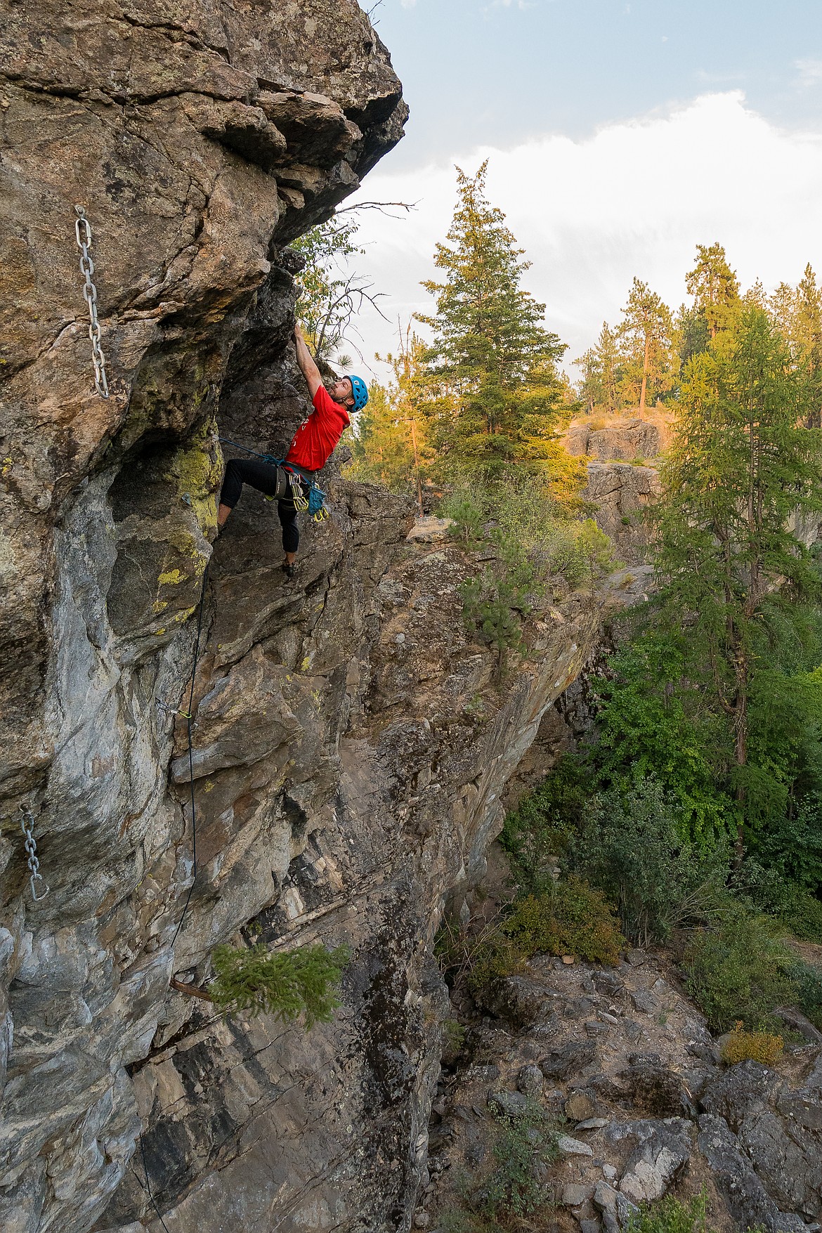 A man makes his way to the top of one of the 165 climbing routes in the parks at Post Falls Community Forest and Q'emiln Park.
