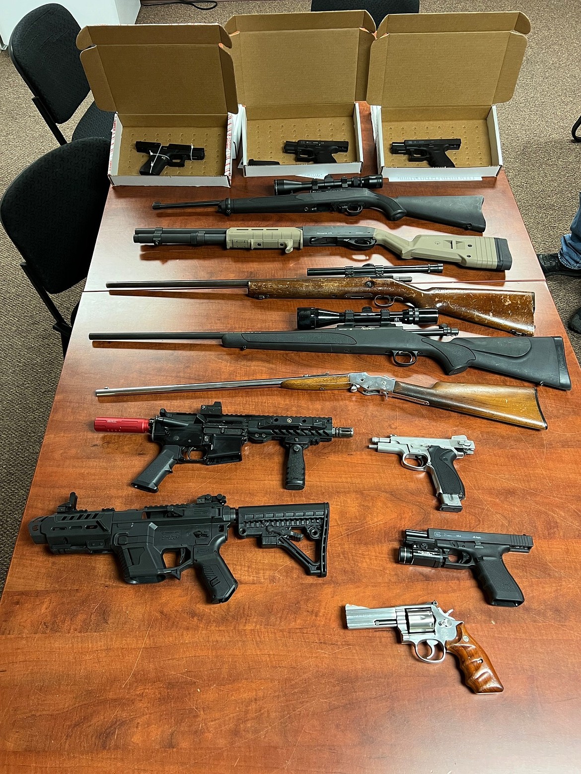 Thirteen weapons were seized along with other evidence as investigators dig into two drive-by shootings that occurred in Moses Lake in late March.